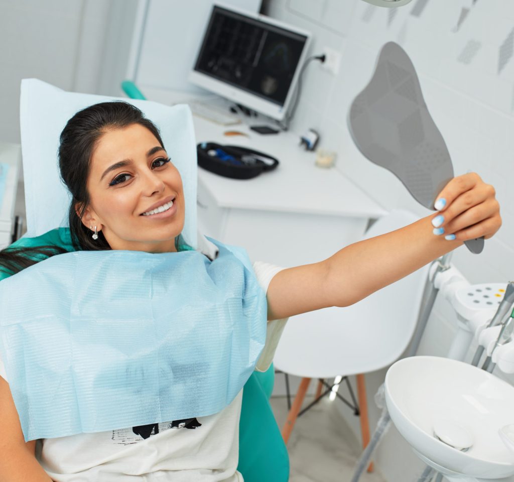 Overview of dental caries prevention.Woman at the dentist's chair during a dental procedure. Beautiful Woman smile close up. Healthy Smile. Beautiful Female Smile.