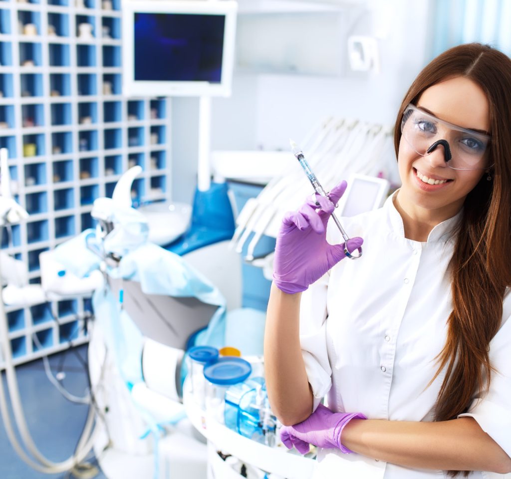 Portrait of a beautiful young girl on the background of the dentist's office. Orthodontic Treatment. Healthy Smile.